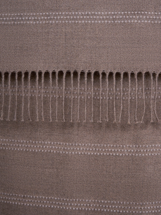 HORIZONTAL PICKSTITCH THROW WITH TWISTED FRINGES.